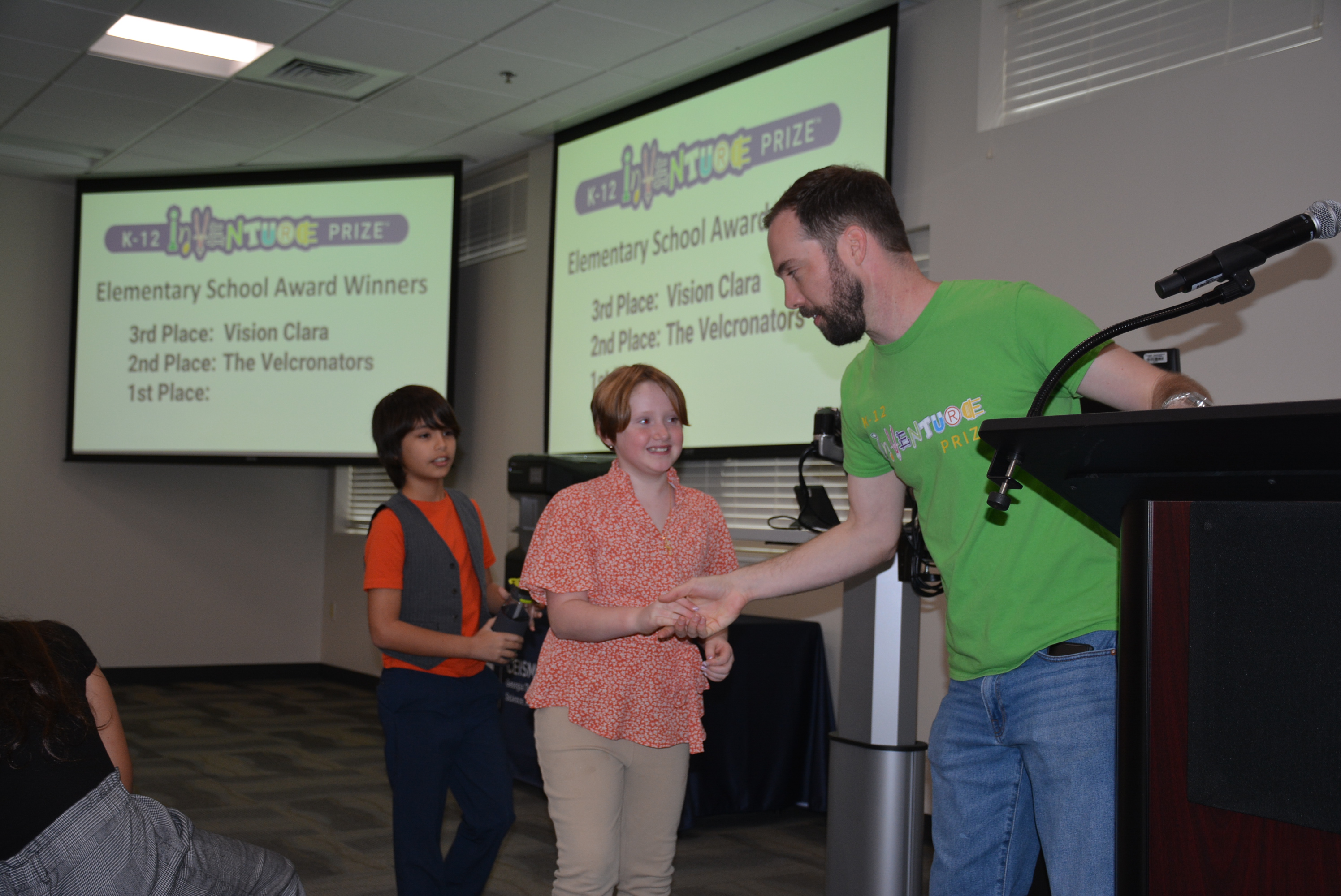 Students recieving award at K-12 InVenture Prize Awards Ceremony